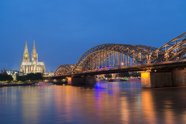 Germany, Cologne, view to Cologne Cathedral with Hohenzollern Bridge and River Rhine in the foreground - MKFF00473