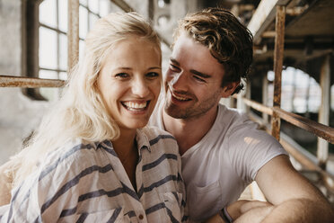 Portrait of happy young couple in an old building - LHPF00515