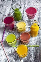 Different colourful smoothies in glasses and bottles - SARF04194