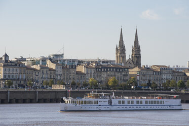 France, Bordeaux, cruise ship before the skyline of Bordeaux - RUNF01635