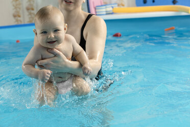 Baby swimming, mother with daughter in swimming pool - VGF00270