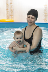 Baby swimming, mother with daughter in swimming pool - VGF00271