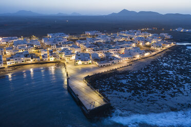 Spain, Canary Islands, Lanzarote, Caleta de Famara, dusk, aerial view - SIEF08501