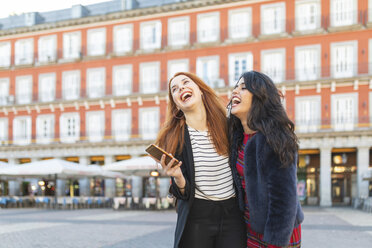 Spain, Madrid, Plaza Mayor, two best friends having fun together in the city - WPEF01448