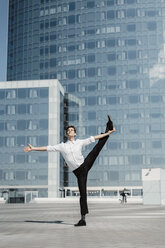 Artist practising on roof terrace - AFVF02648