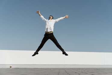 Artist practising on roof terrace - AFVF02666