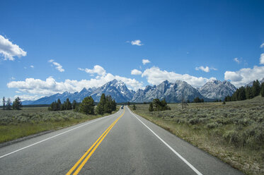 USA, Wyoming, Road leading in the Teton range in the Grand Teton National Park - RUNF01662