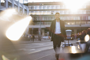 Businessman with suitcase on the move in the city - DIGF06489