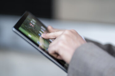 Close-up of businessman using tablet - DIGF06497