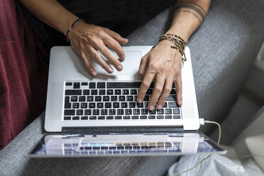 Man's hands using laptop - AFVF02715