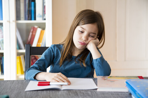 Frustrated girl with homework stock photo
