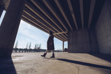 Young woman walking at an underpass - RSGF00173