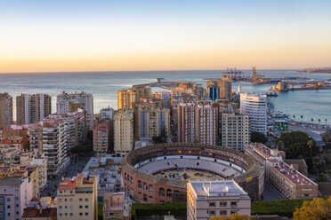 Spain, Malaga, view over the harbour and La Malagueta bullring by sunrise - TAMF01202
