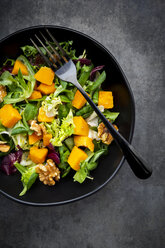 Bowl of mixed green salad with hokkaido pumpkin and walnuts - LVF07953