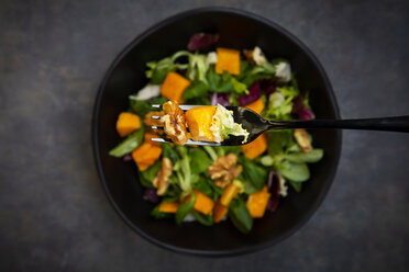 Bowl of mixed green salad with hokkaido pumpkin and walnuts - LVF07954