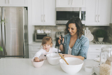 Mother and daughter making a cake together - CMSF00032