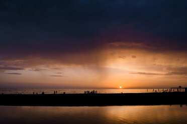 Russia, Sochi, rainfall over the sea at sunset - EYAF00093