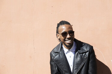 Portrait of a happy young man with sunglasses outdoors - IGGF00946