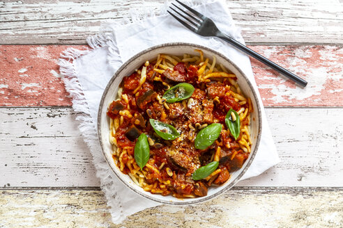 Bowl of pasta with aubergine tomato sugo garnished with pine nuts, parmesan and basil - SARF04224