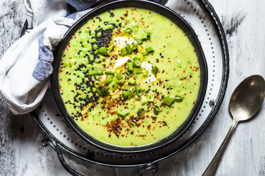 Bowl of Fresh green pea soup with spring onions - SBDF03932