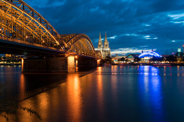 Dome Cathedral, Hohenzollern bridge and theater along Rhine river at night, Cologne, Nordrhein-Westfalen, Germany - CUF50009