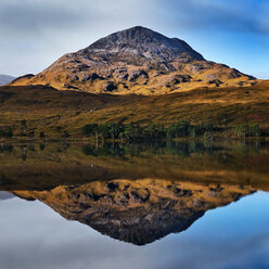 Tranquil mountain landscape mirror imaged in loch, Achnasheen, Scottish Highlands, Scotland - CUF50082