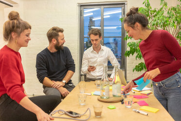 Mid adult business team meeting at conference table in office - CUF50153