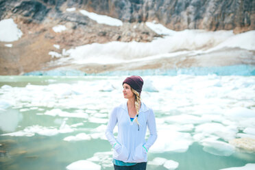 Woman enjoying view by lake, Jasper, Canada - ISF21102
