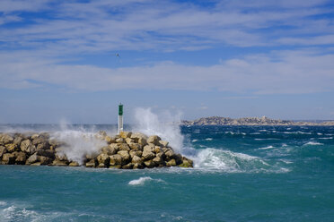 France, Marseille, Place Florence Arthaud, La Madrague, strong waves at a jetty with lighthouse - LBF02536