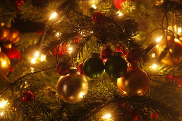 Christmas tree with Christmas baubles and light chains, partial view - JTF01213