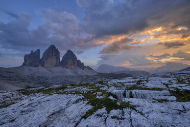 Italy, Sexten Dolomites, Tre Cime di Lavaredo at sunset, Nature Park Tre Cime, Unesco World Heritage Natural Site - RUEF02135