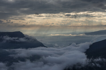 Italy, Dolomites, Sout Tyrol, View from the mountain Seceda to clouds over mountains - RUEF02170