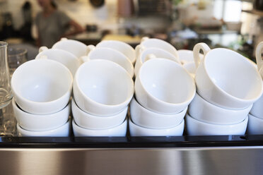 Lots of coffee cups in a cafe - IGGF01159