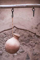 Clay jar hanging on a hook in Nizwa Fort, Nizwa, Oman - WVF01169