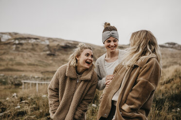 UK, Scotland, happy female friends in rural landscape - LHPF00542