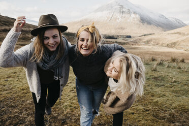 UK, Scotland, Loch Lomond and the Trossachs National Park, happy female friends in rural landscape - LHPF00559