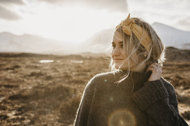 UK, Scotland, Loch Lomond and the Trossachs National Park, portrait of young woman in rural landscape - LHPF00574