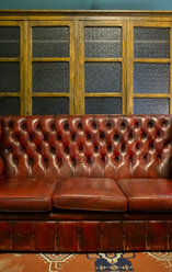 Leather sofa in a vintage furniture shop - MGOF04022