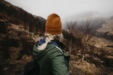 UK, Scotland, Highland, rear view of young woman in rural landscape - LHPF00585