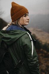 UK, Scotland, Highland, portrait of young woman in rural landscape - LHPF00586