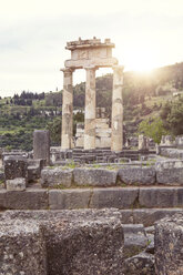 Greece, Delphi, tholos in the sanctuary of Athena Pronaia at sunset - MAMF00540