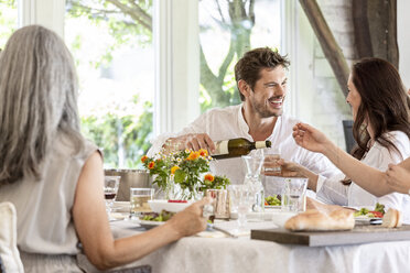 Happy family celebrating together, drinking wine - PESF01593