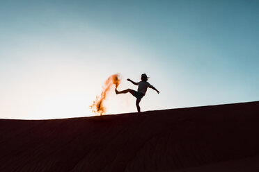 Sultanate Of Oman, Wahiba Sands, Mid adult man is playing with sand in the desert - WVF01395