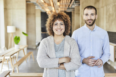 Portrait of smiling colleagues in modern office - FMKF05559