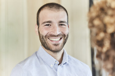 Portrait of happy businessman - FMKF05587