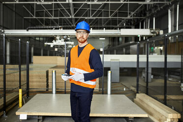 Portrait of worker with tablet in factory warehouse - ZEDF02199