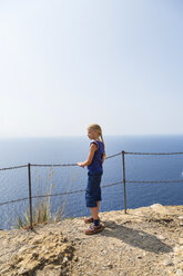 Italy, Liguria, Portofino, girl at the coast looking at view - HSIF00530