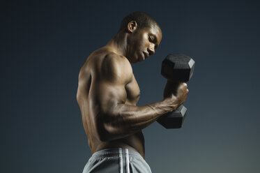 African American man lifting weights - BLEF00021