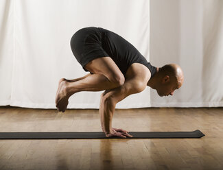 Man doing yoga Stock Photos, Royalty Free Man doing yoga Images