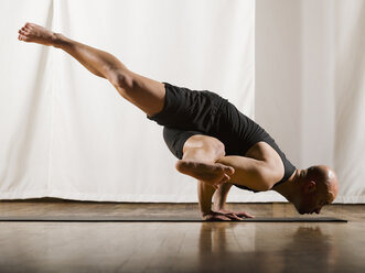 Hispanic man practicing yoga - BLEF00033